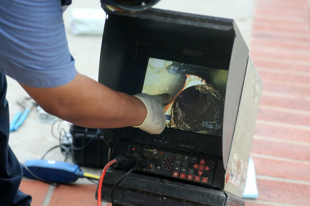Technician viewing a drain inspection camera in Upland